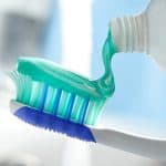 toothpaste on toothbrush